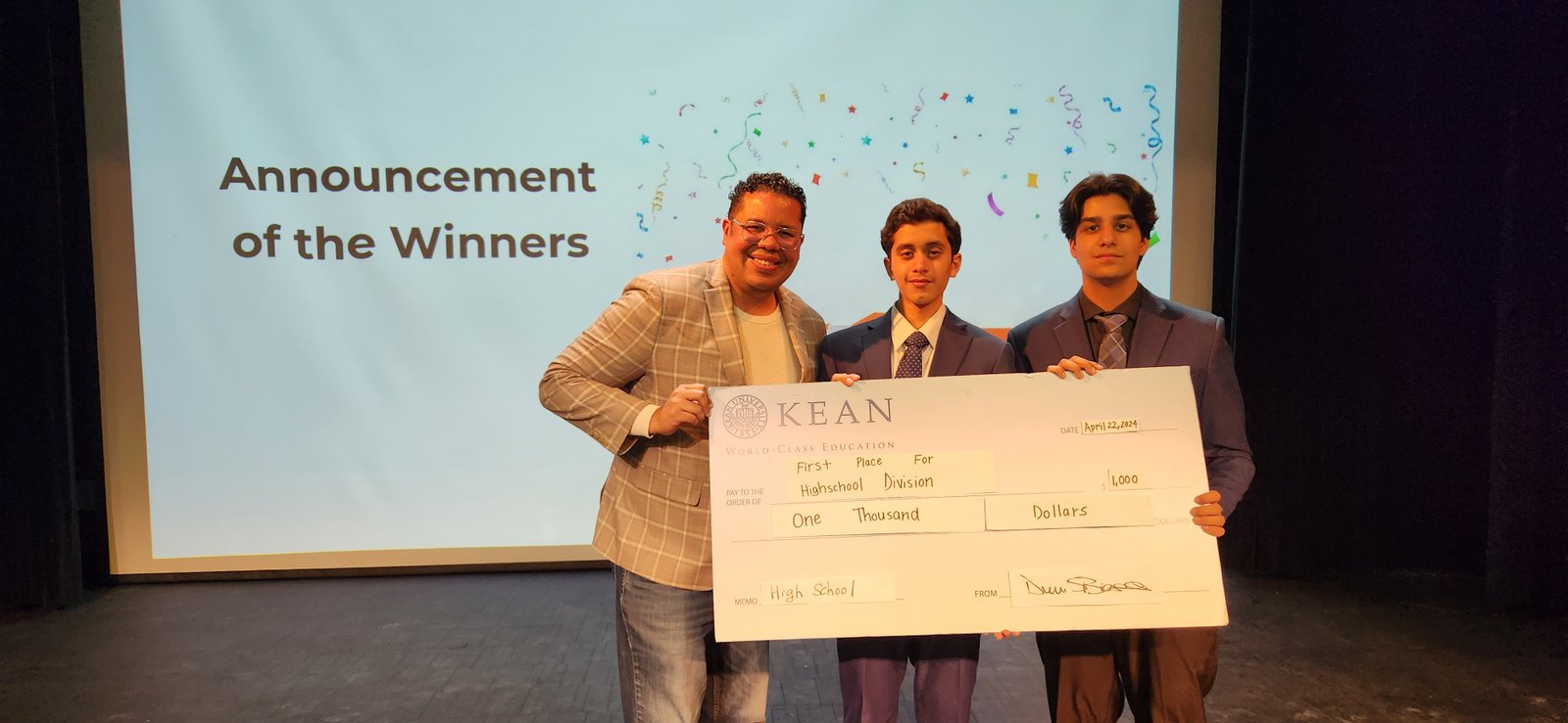 Karan Verma and Aditya Herekar accepting the first-place check at the 2024 Kean Business Plan Competition
